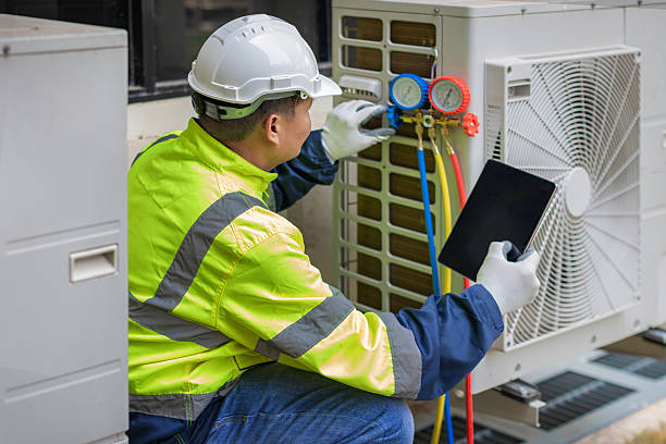 Professional Hvac technician working in Kill Devil Hills, NC